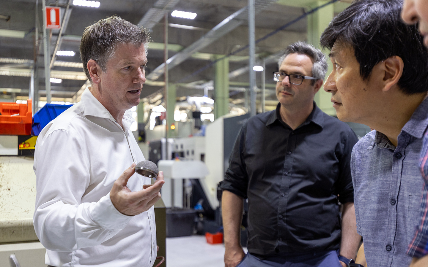 Professor Peter Lee and researchers tour Signature Orthopaedics manufacturing facility with Dr Declan Brazil. Image: supplied. 