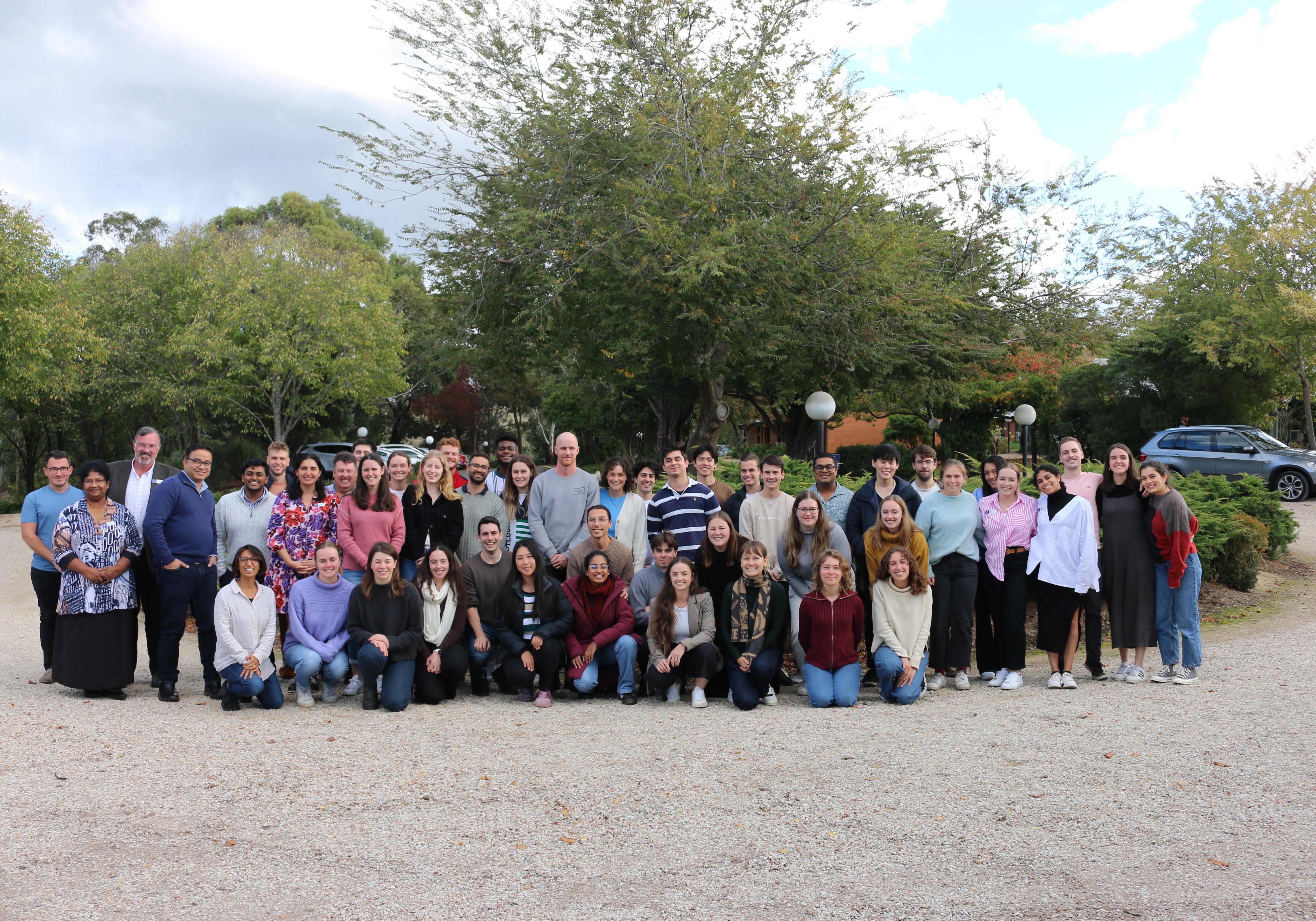 Students and staff in a group photo outside