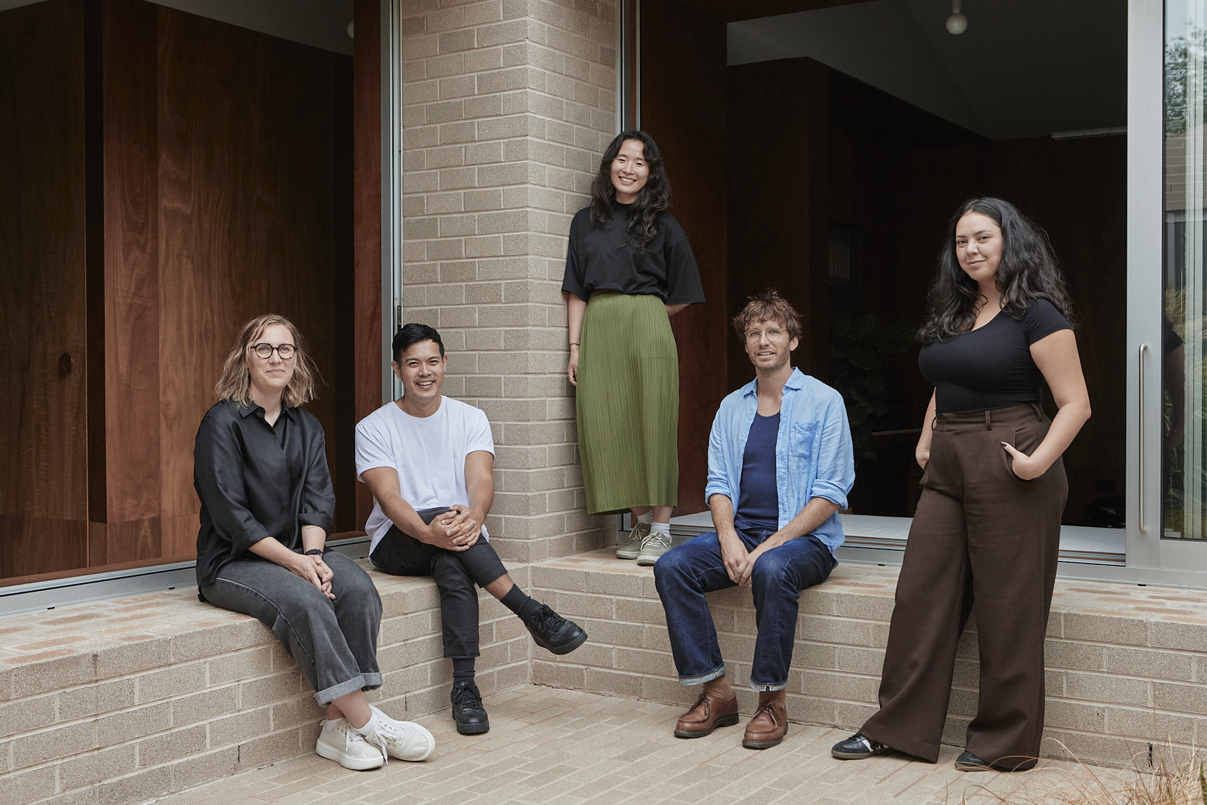 Australian Institute of Architects’ Dulux Study Tour recipients Gumji Kang and Jimmy Carter smiling, pictured with the rest of the 2025 cohort.