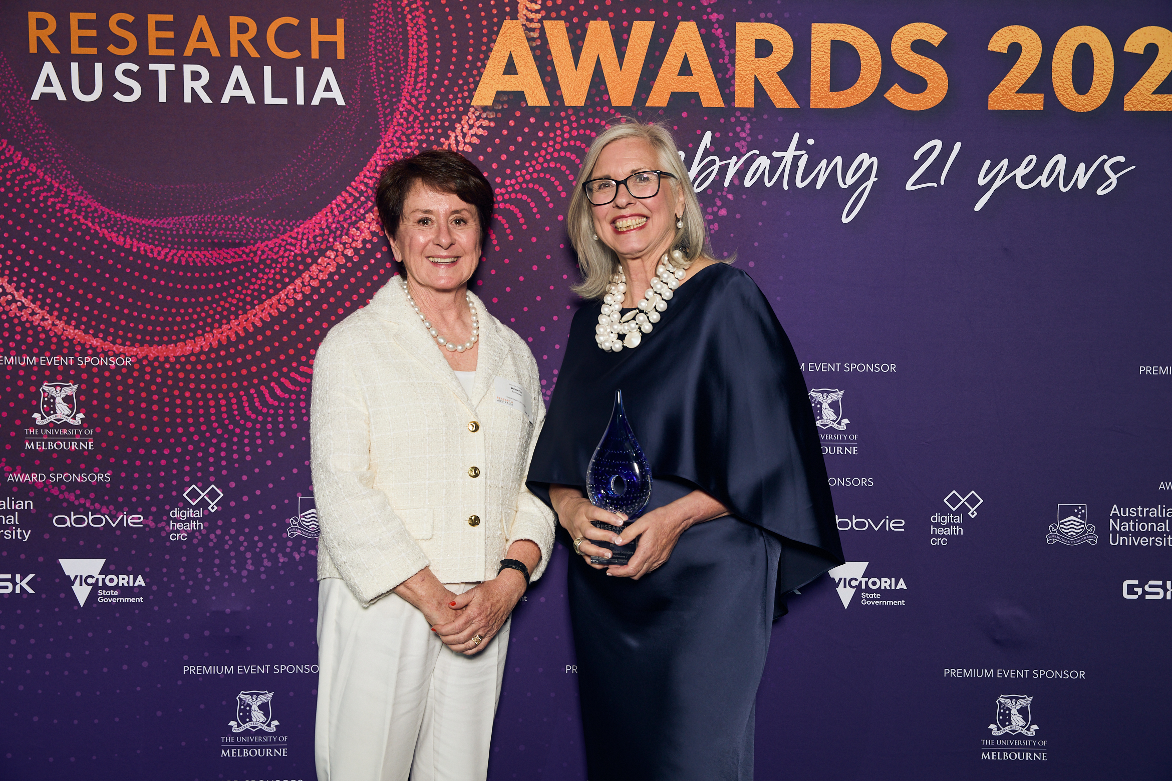 Professor Christobel Saunders with her award from Research Australia