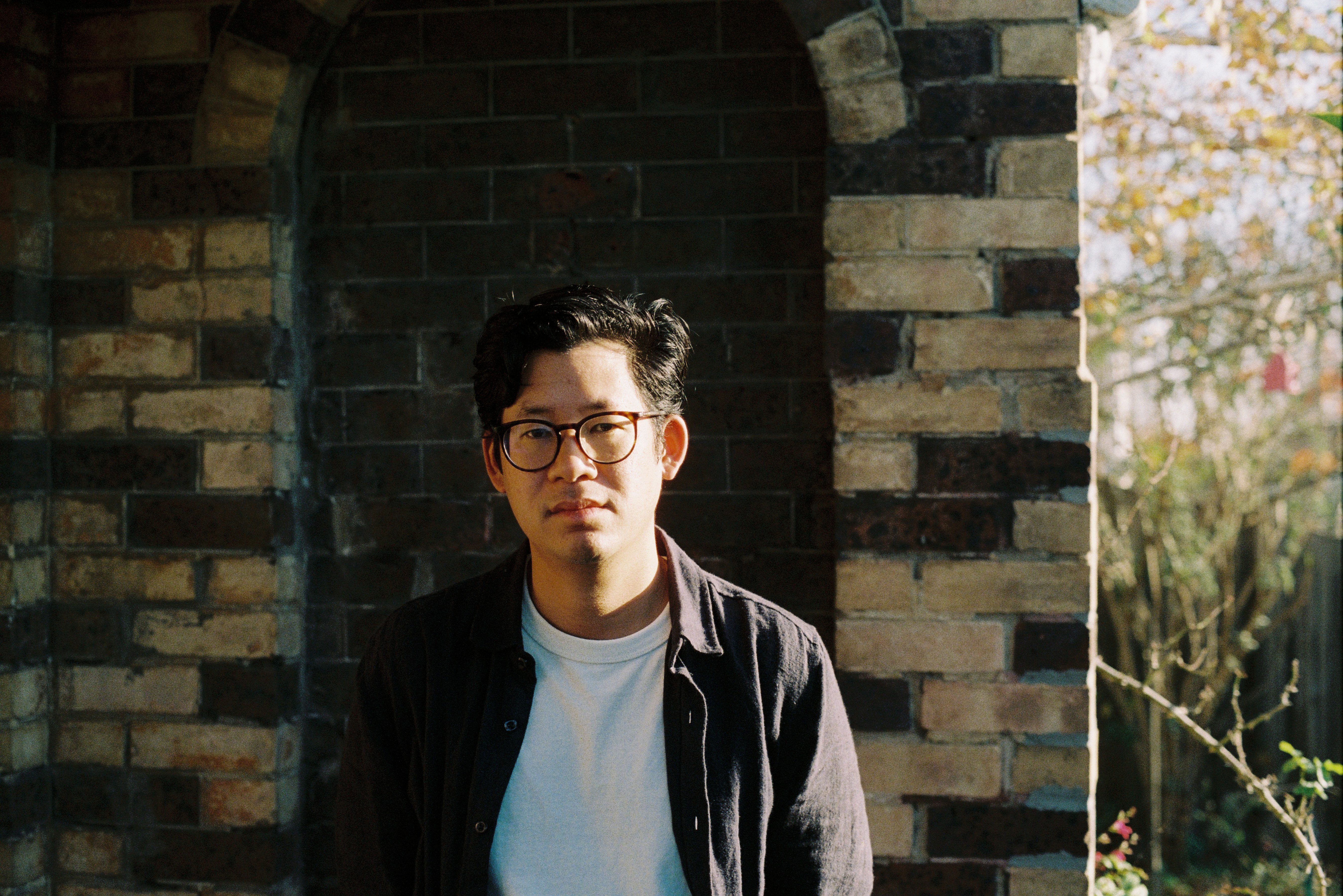 A wide headshot of Dr André Dao. 